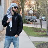 Palestine Man wearing keffiyeh and windbreaker streetwear with cars background