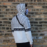 Pali Keffiyeh Half Hoodie - White-Hoodie-Description This hoodie is one of a kind and a signature Pali-Mart piece. The iconic keffiyeh (also spelled kufiya) pattern is beautifully displayed in this piece with the front and back each showcasing different aspects of the pattern. The band moving across the hoodie is also true to the keffiyeh design with the added bonus of "Palestine" being repeated in Arabic. You won't find this anywhere else. Get yours now before we sell out again! Quality This ho