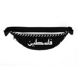 Layl Keffiyeh Fanny Pack-Fanny Pack-Description Strap up with our signature layl (night) keffiyeh (also spelled kufiya) fanny pack! It's the ultimate accessory that has everything—the right size, a small inside pocket, and adjustable straps—to become your favorite fashion item. Be sure to pair it with our Layl Face Mask or other items from our catalog to make a more complete look! Get yours today! Features • 100% polyester• Dimensions: H 6.5'' (16cm), W 13'' (33cm), D 2¾'' (7cm)• Water-resistant